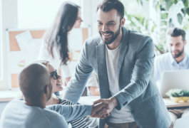 man shaking hands to another man