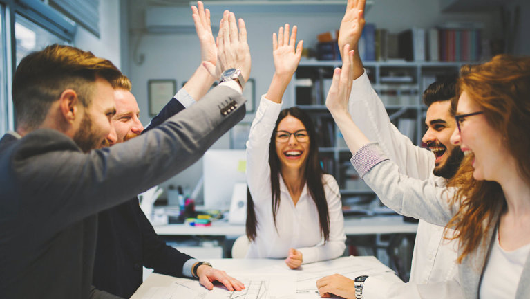 group of people giving high five