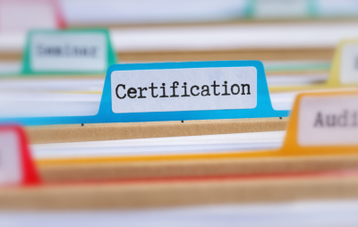 File folders with a tab labeled Certification